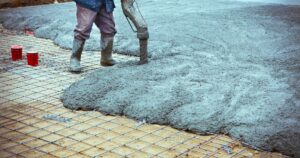 man pouring concrete