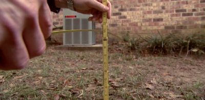 Measuring ground slope from foundation.