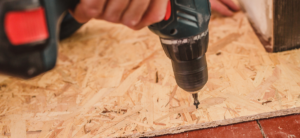 man installing subfloor